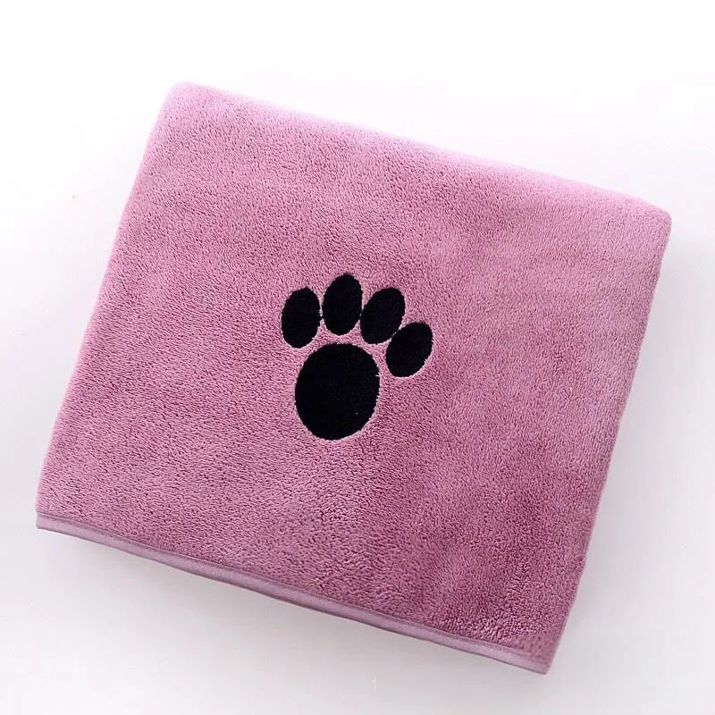 Pink microfiber pet towel with a black paw print